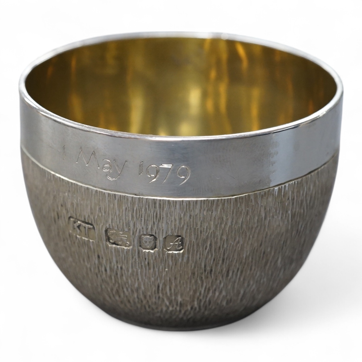 An Elizabeth II textured silver tumbler cup, possibly by Keith Tyssen, London, 1975, with later engraved inscription, height 50mm, 136 grams.